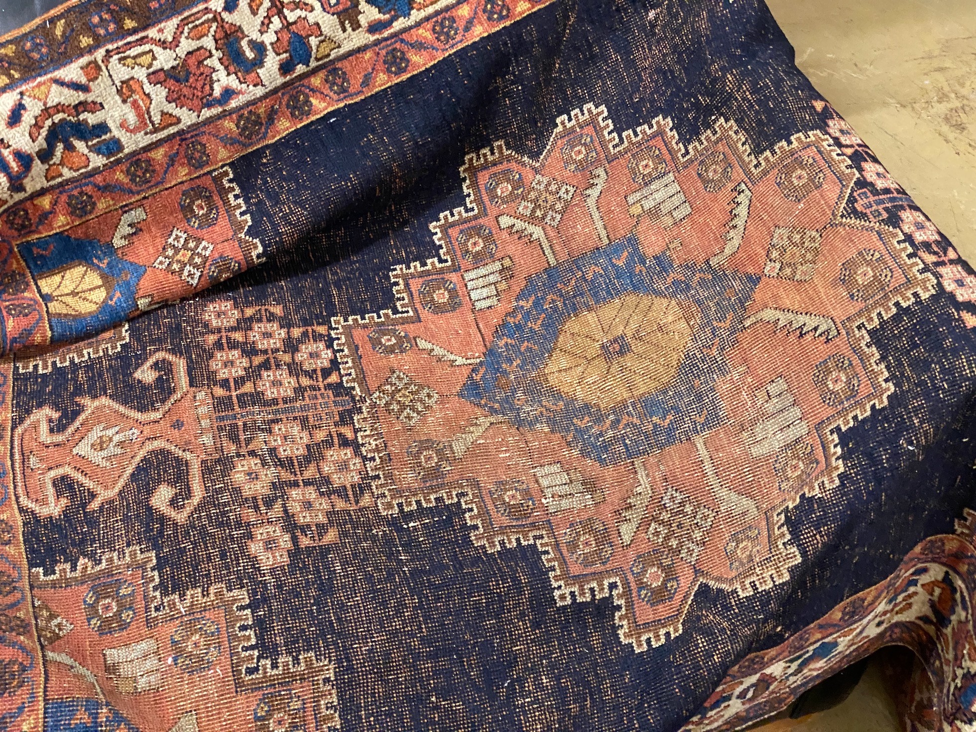 An antique Afshar rug, 190 x 34cm and a cream ground carpet with stylised Greek border